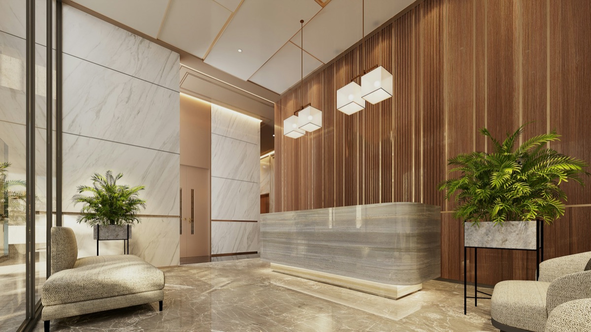Recepción corporativa con muros de madera, mostrador de piedra y lámparas colgantes